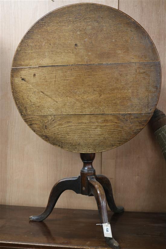 A george III oak tripod table. W.71cm